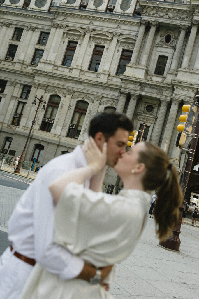 Bride-and-groom-sharing-a-romantic-portrait-outside-Philadelphia-City-Hall-on-their-wedding-day