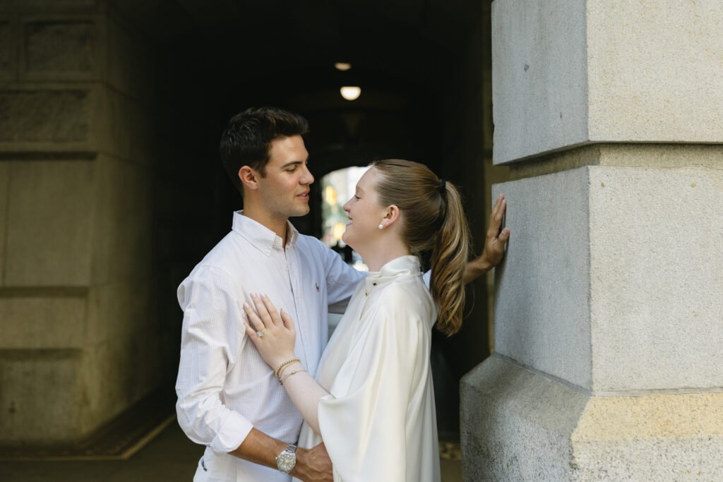 Bride-and-groom-sharing-a-romantic-portrait-outside-Philadelphia-City-Hall-on-their-wedding-day