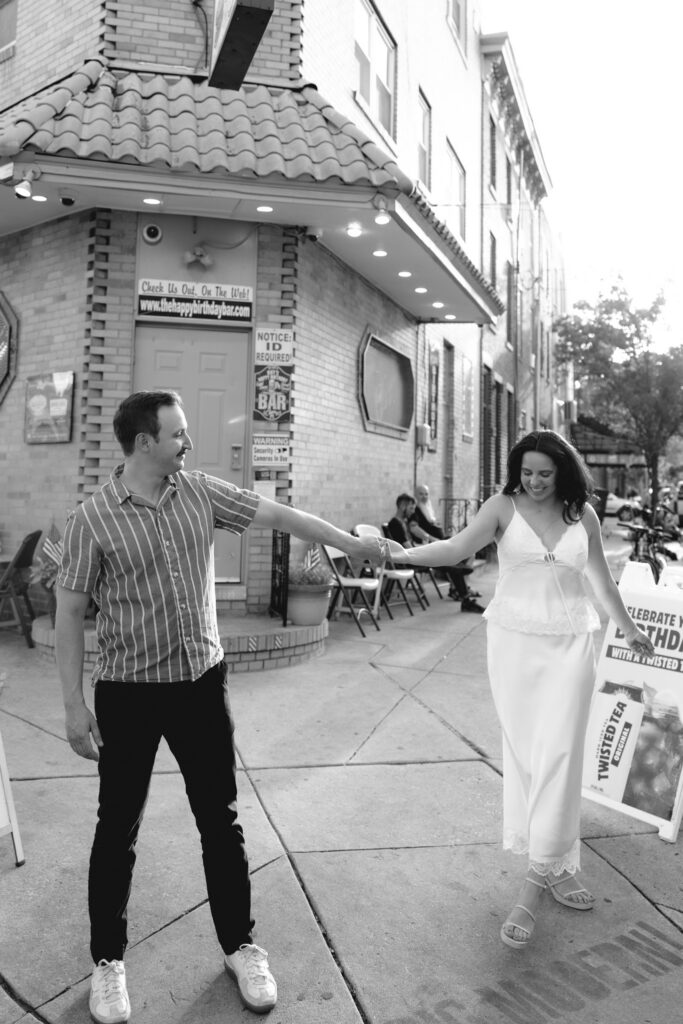 Couple-holding-hands-during-an-engagement-session-at-Rittenhouse-Square-in-Philadelphia-Pennsylvani