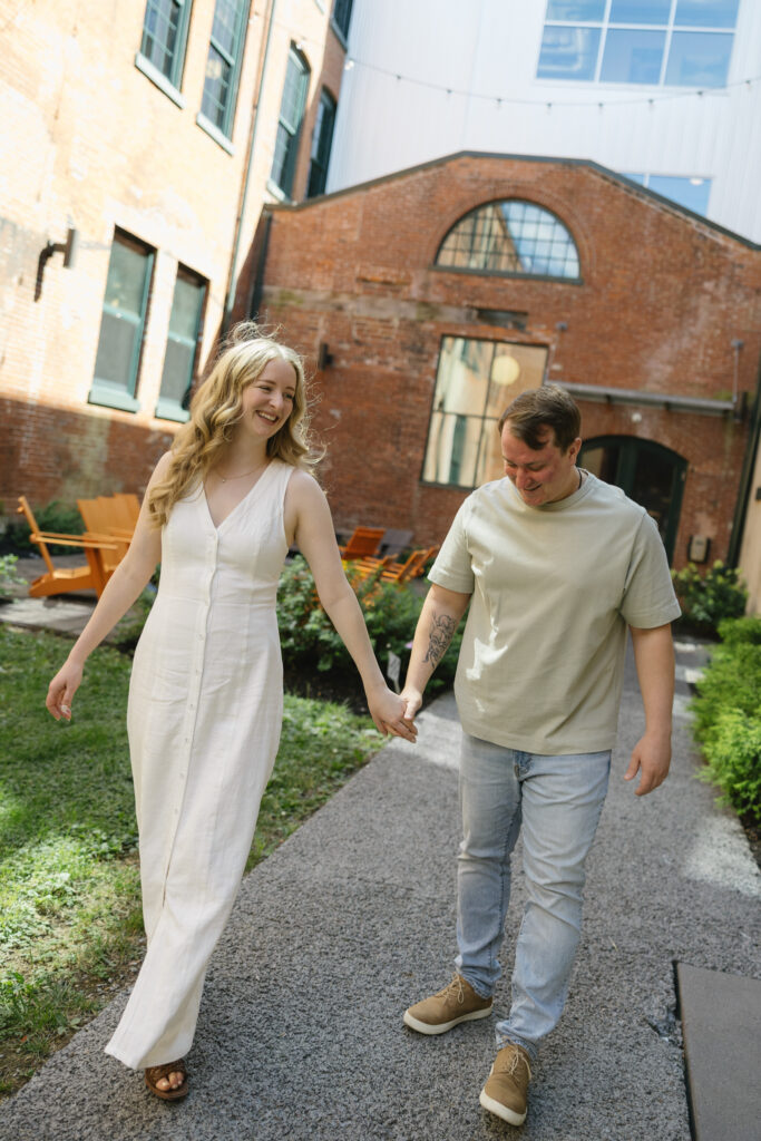 Romantic-engagement-photos-of-a-couple-walking-through-Rittenhouse-Square-Park-in-Philadelphia